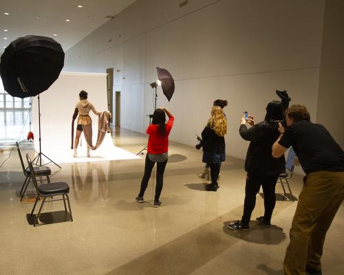 photographer taking a picture in a studio