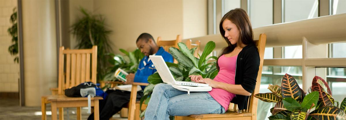 Associate of Arts Programs at Minneapolis College Two students sitting in chairs, studying