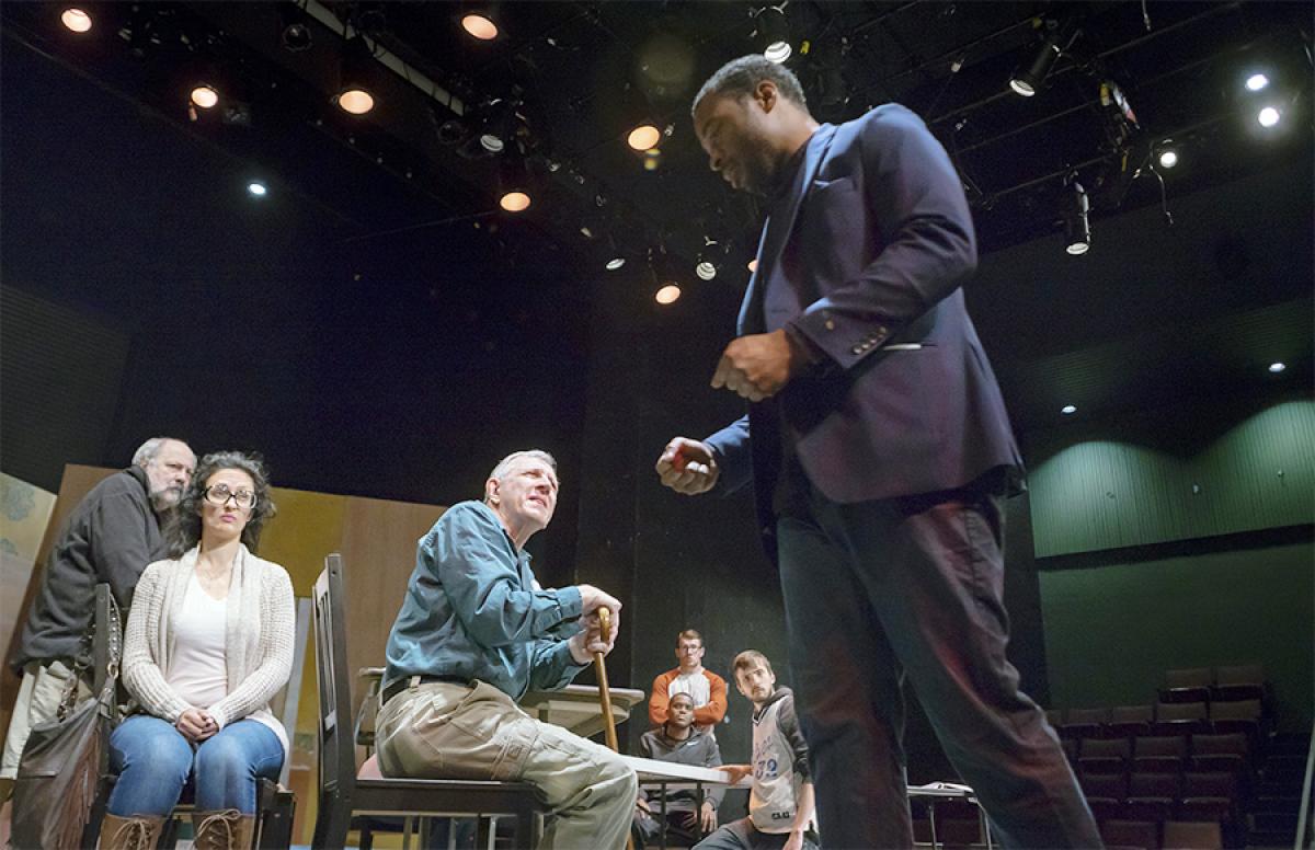 Twelve Angry Jurors Theater Production at Minneapolis College Man talking to group