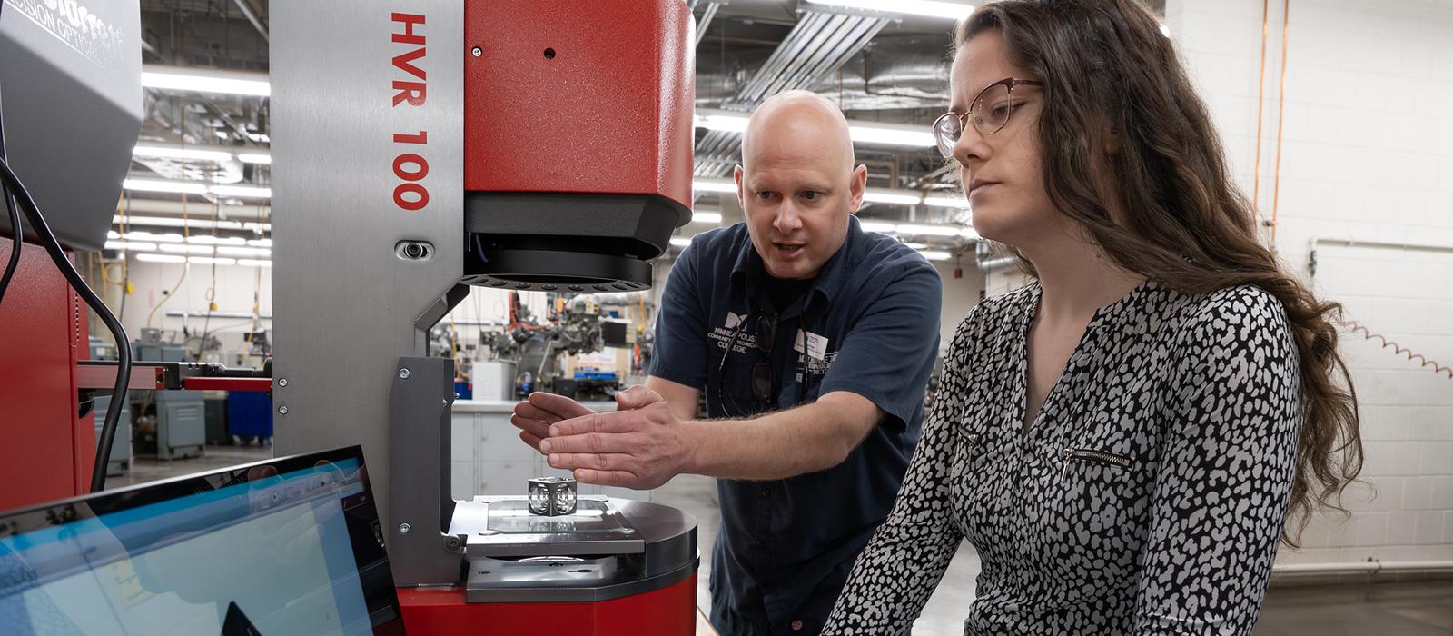 An instructor and a student work together in the Machine Technologies lab. 
