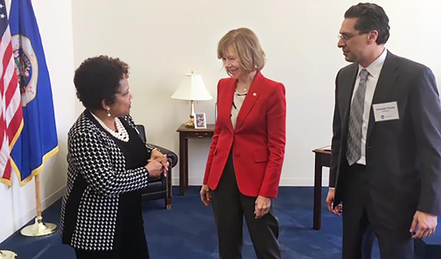 Dr. Pierce with Senator Tina Smith and Board President Orlando Flores