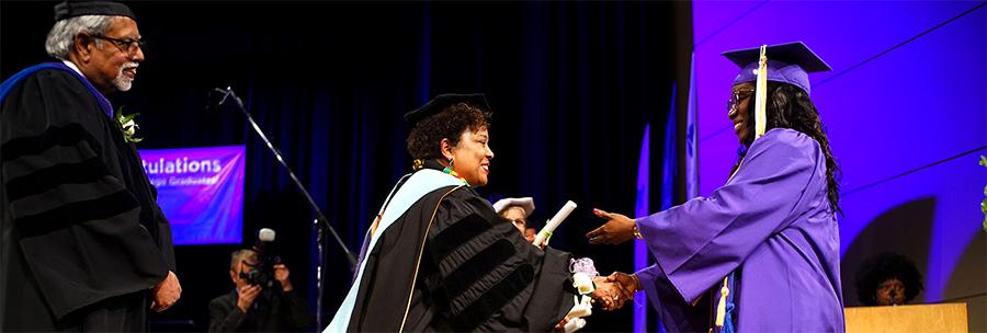 student receiving their diploma in 2019