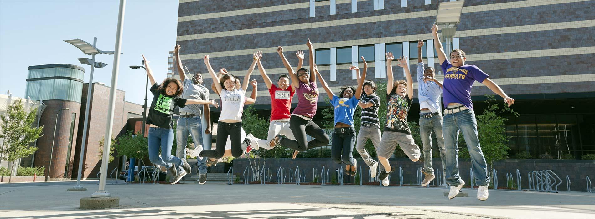 students jumping in mid-air