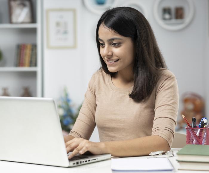 Young woman looking at laptop