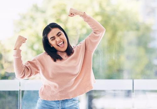 happy young woman with arms in air happy young woman with arms in air