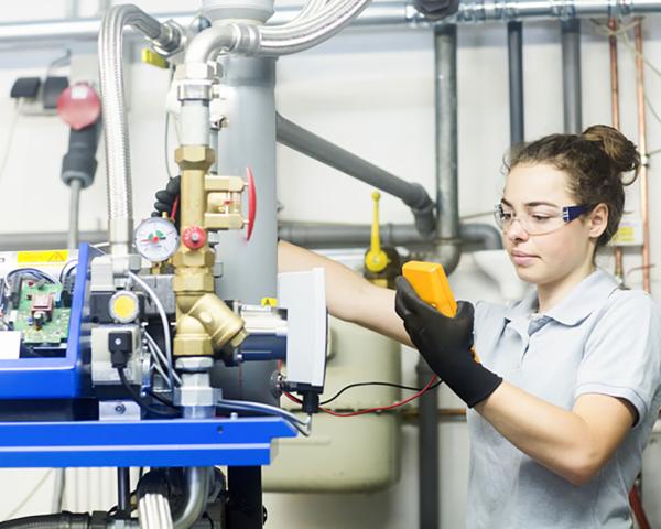 Woman looking at an air conditioner 