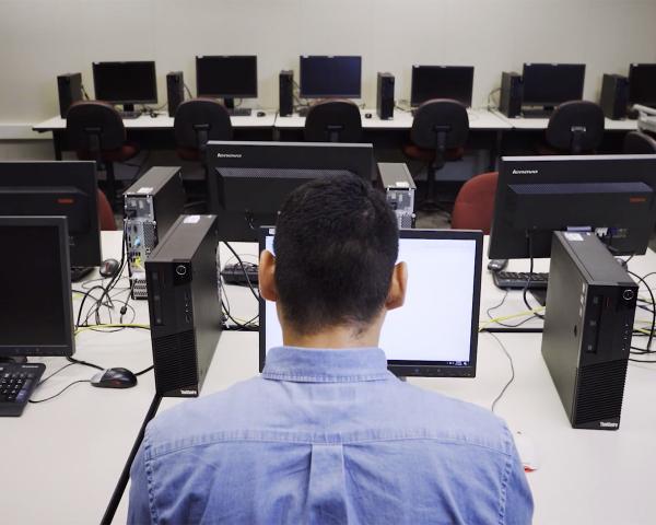 student with computers