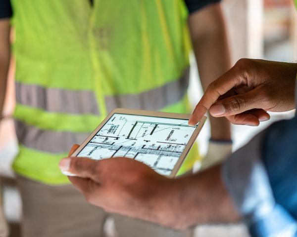 Hand holding tablet