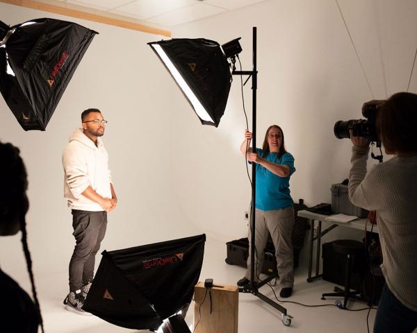 School of Design and the Arts student positioning for a class project