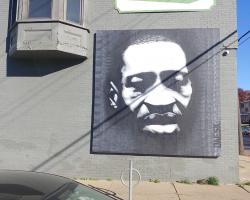 Corner of Glenwood Ave. and N. Newton Ave. painting of George Floyd