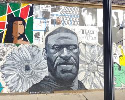 Corner of Hennepin Ave. and W. 24th St. George Floyd wall portrait