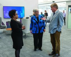 President Pierce and two others stand in the new MEC buiding