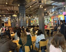Instructor Jason Cussler's class gathered inside Midtown Global Market. 