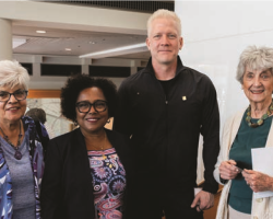 President Pierce stands with two women and one man