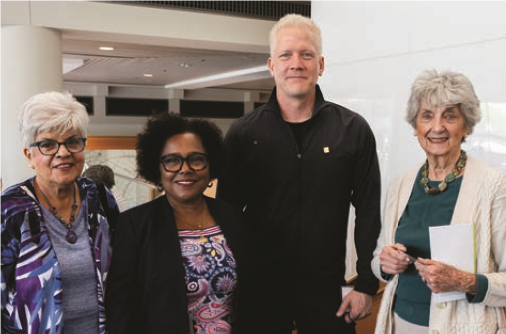 President Pierce stands with two women and one man